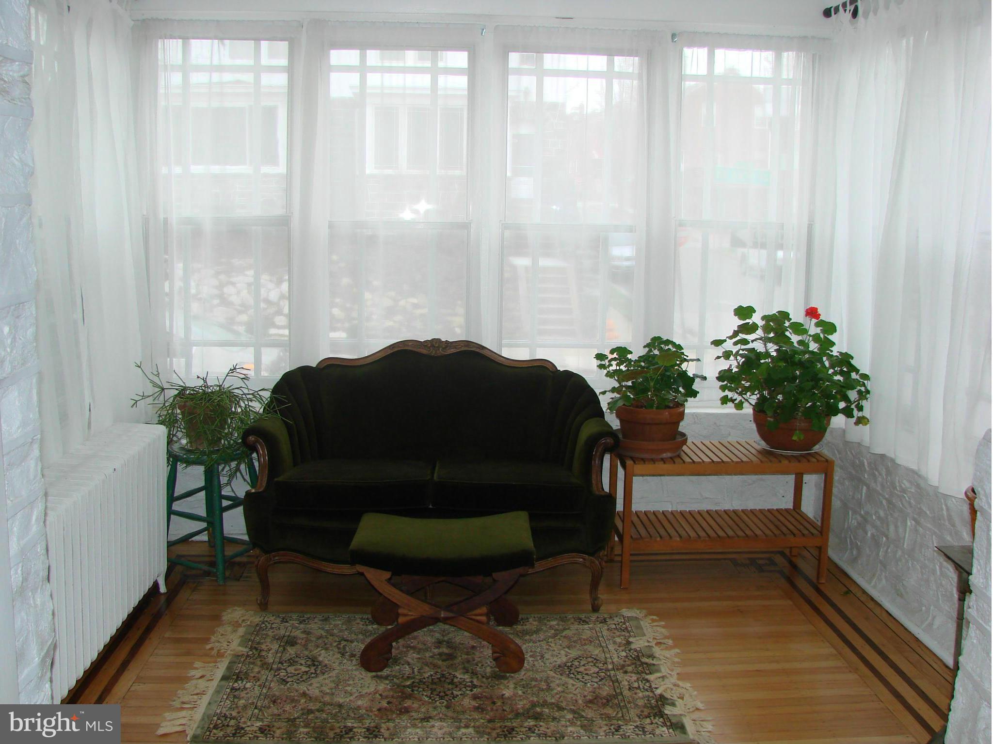 3633 Yolando Road Baltimore, MD 21218 - Photo 7 of 24 a living room with furniture and a potted plant
