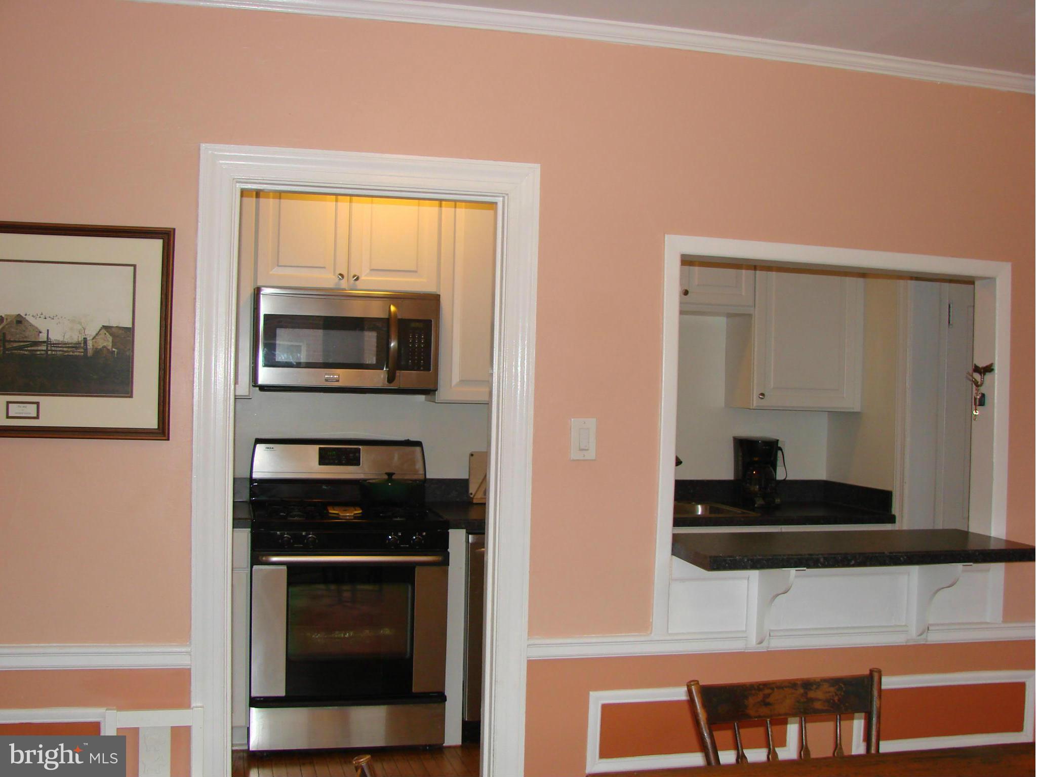 3633 Yolando Road Baltimore, MD 21218 - Photo 10 of 24 a kitchen with stainless steel appliances a stove a microwave and a sink