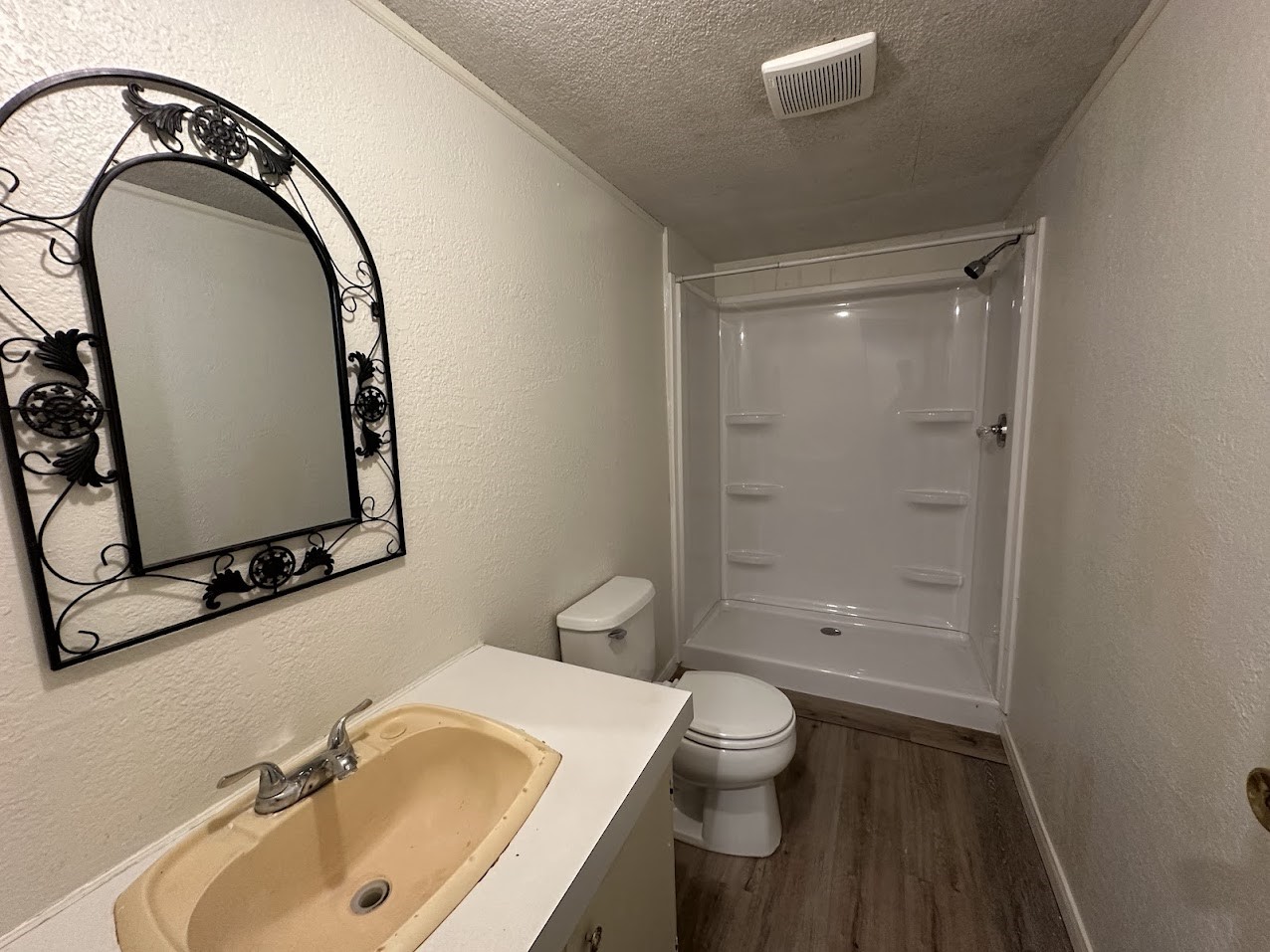 26518 McIntosh Road Magnolia, TX 77355 - Photo 11 of 17 a bathroom with a sink a toilet and a mirror