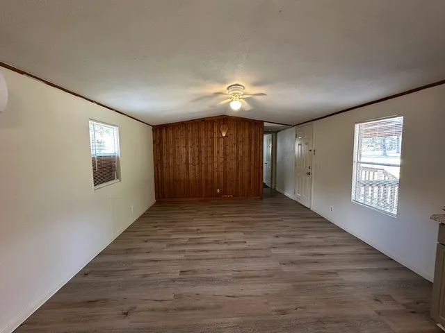 a view of an empty room with windows
