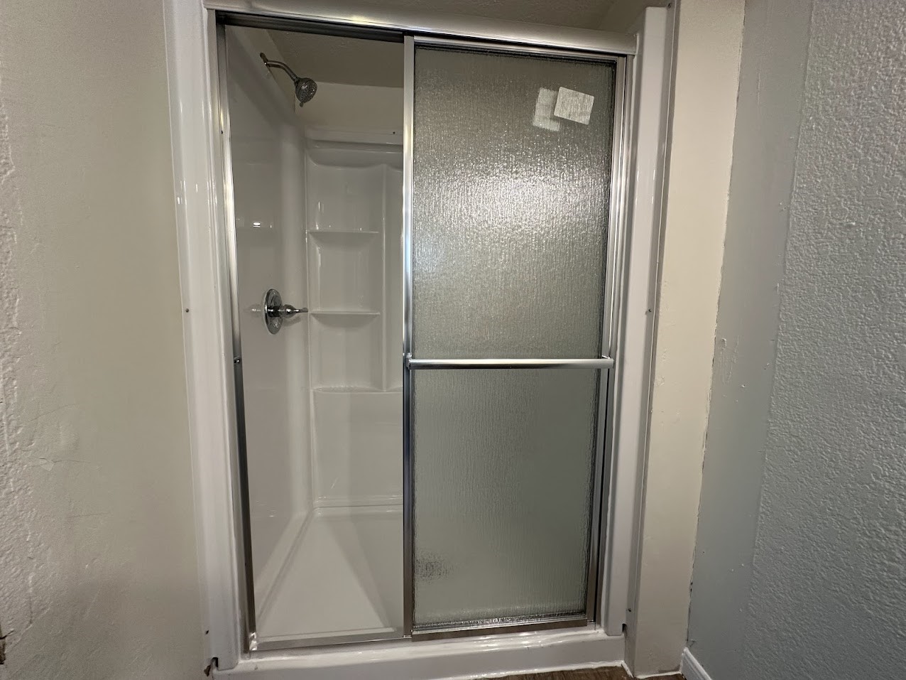 26518 McIntosh Road Magnolia, TX 77355 - Photo 8 of 17 a bathroom with a glass shower door