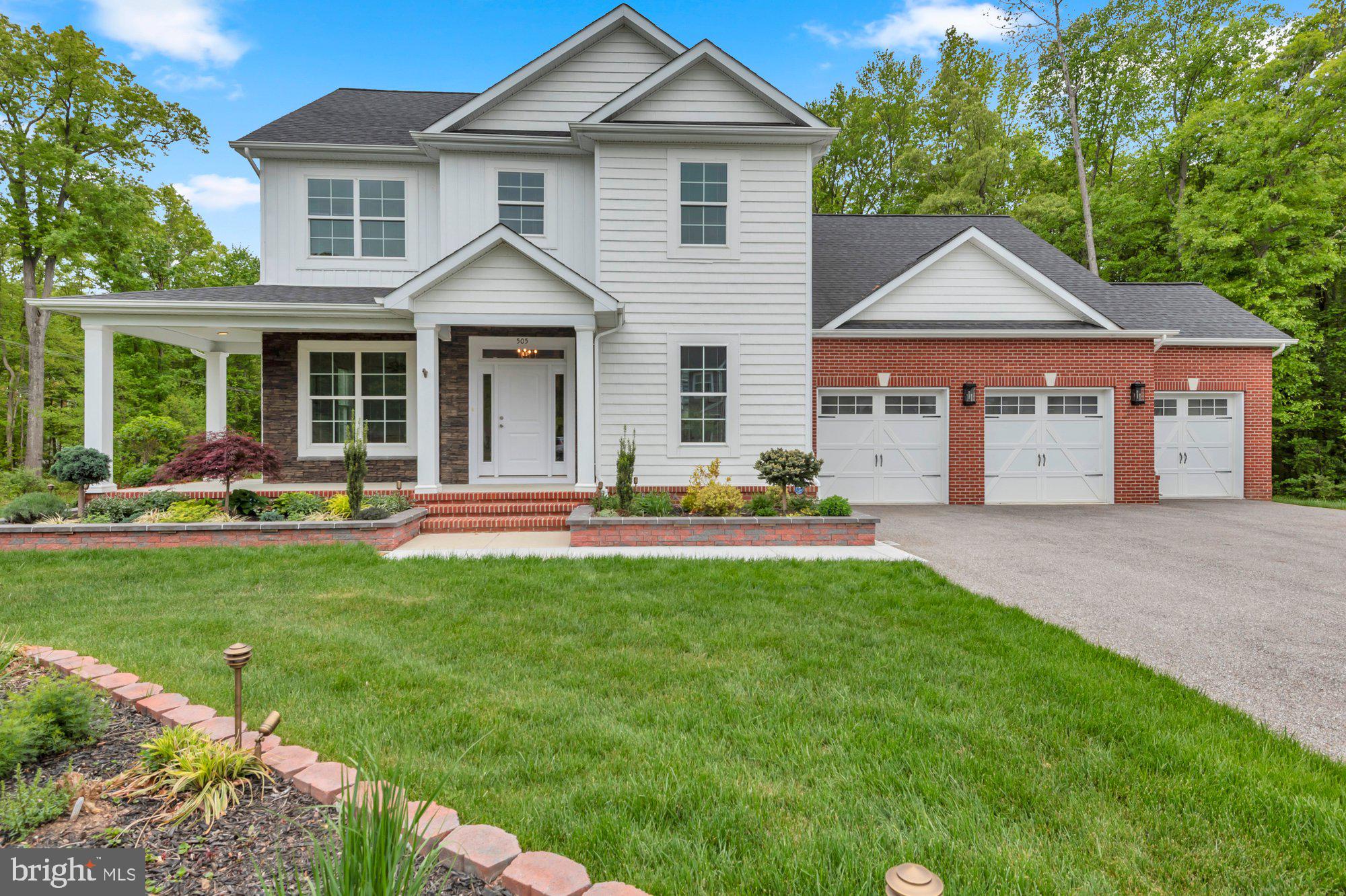 505 Brewerton Lane Edgewater, MD 21037 - Photo 1 of 78 a front view of a house with a yard and trees