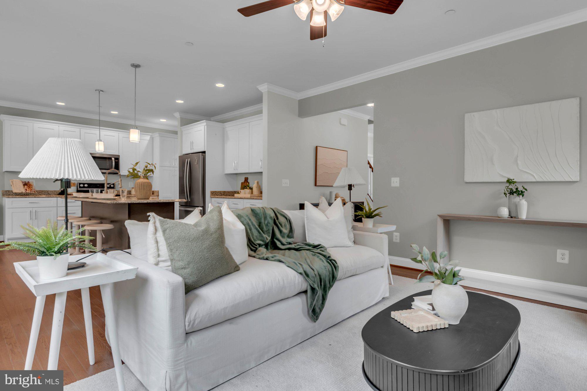 505 Brewerton Lane Edgewater, MD 21037 - Photo 13 of 78 a living room with furniture kitchen view and a chandelier