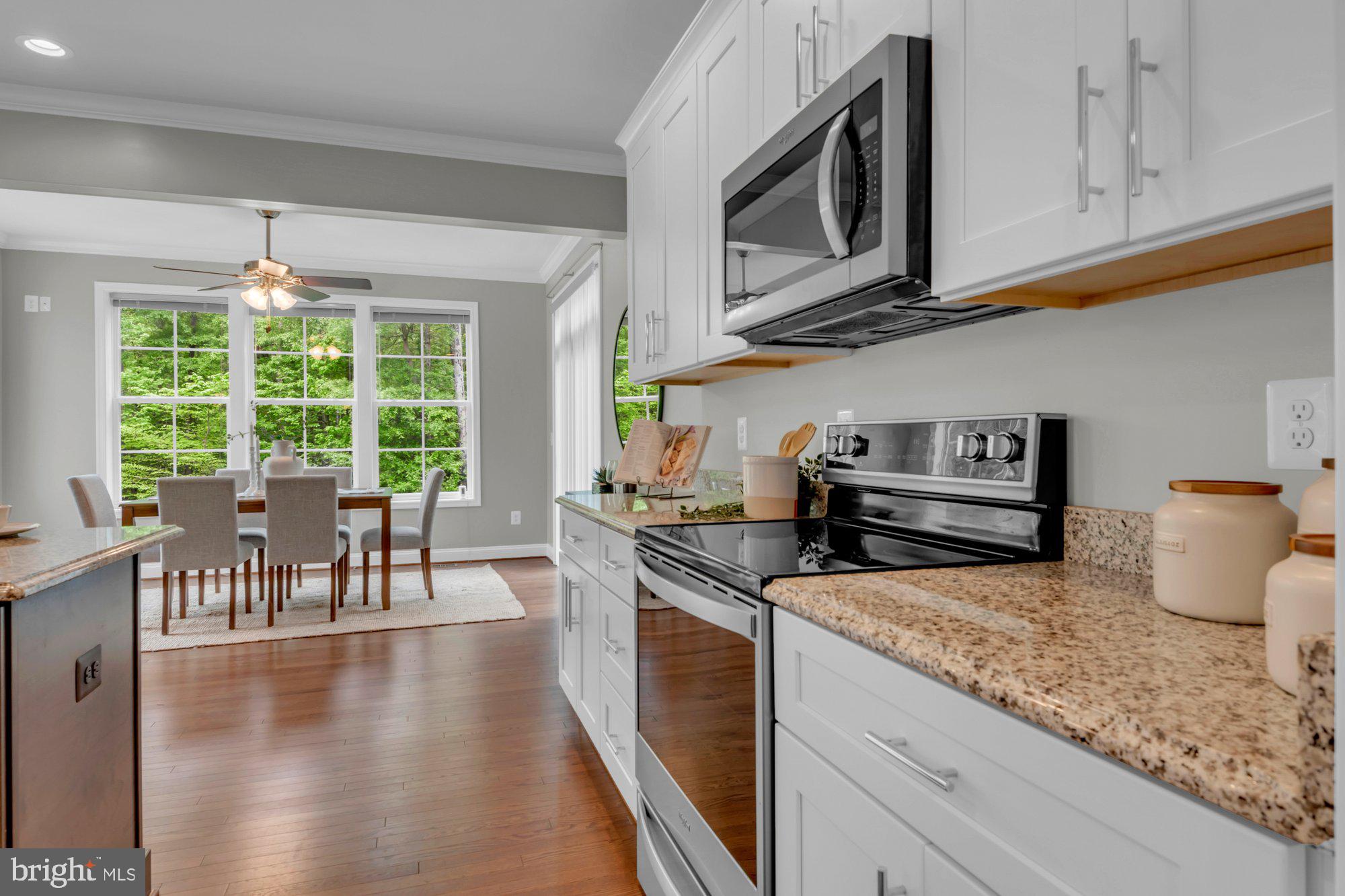 505 Brewerton Lane Edgewater, MD 21037 - Photo 18 of 78 a kitchen with stainless steel appliances granite countertop a stove a sink and a microwave