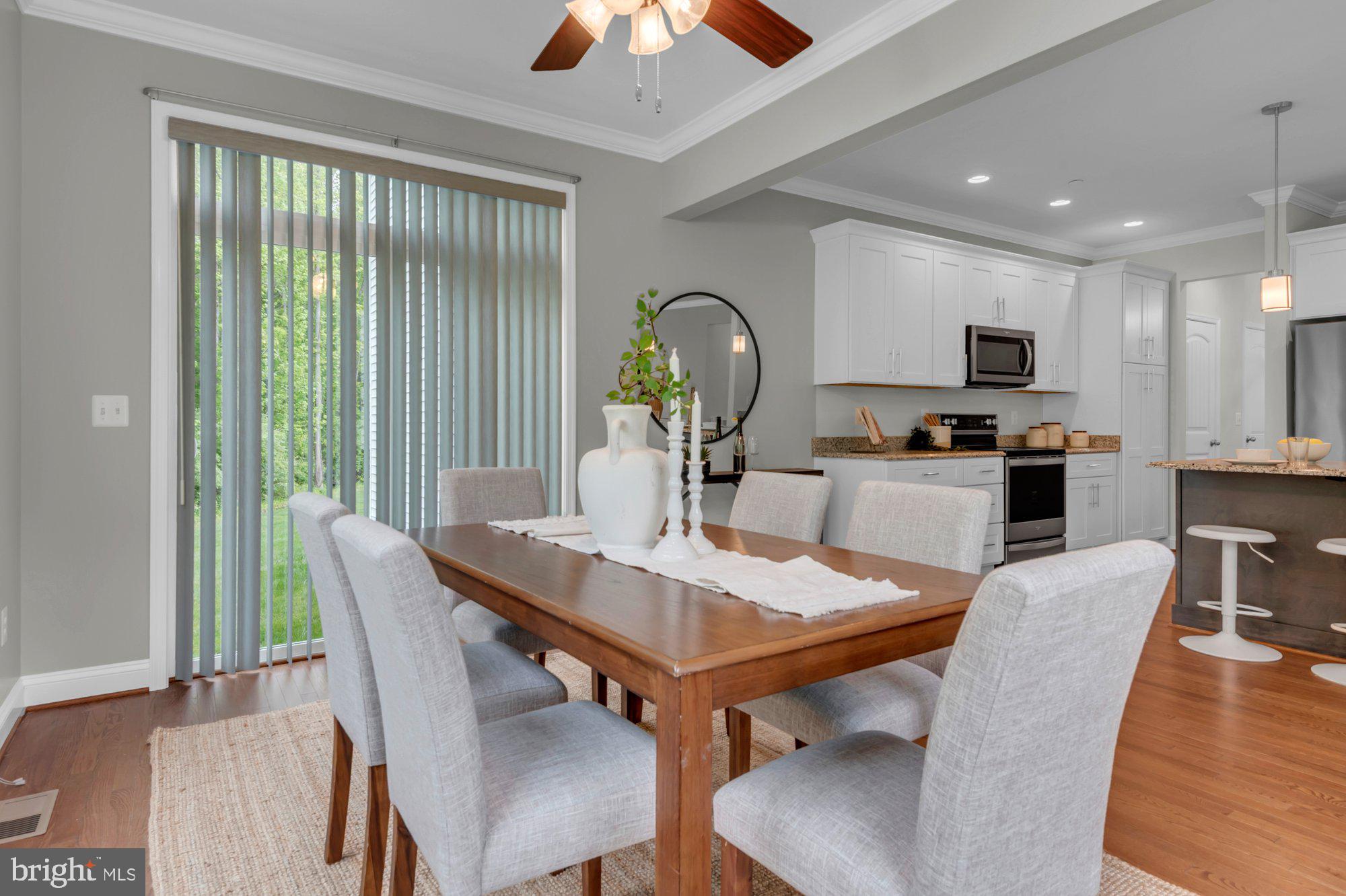 505 Brewerton Lane Edgewater, MD 21037 - Photo 21 of 78 a view of a dining room with furniture window and wooden floor