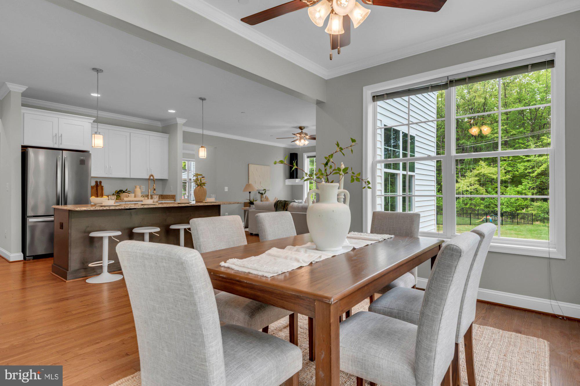 505 Brewerton Lane Edgewater, MD 21037 - Photo 22 of 78 a view of a dining room with furniture window and wooden floor
