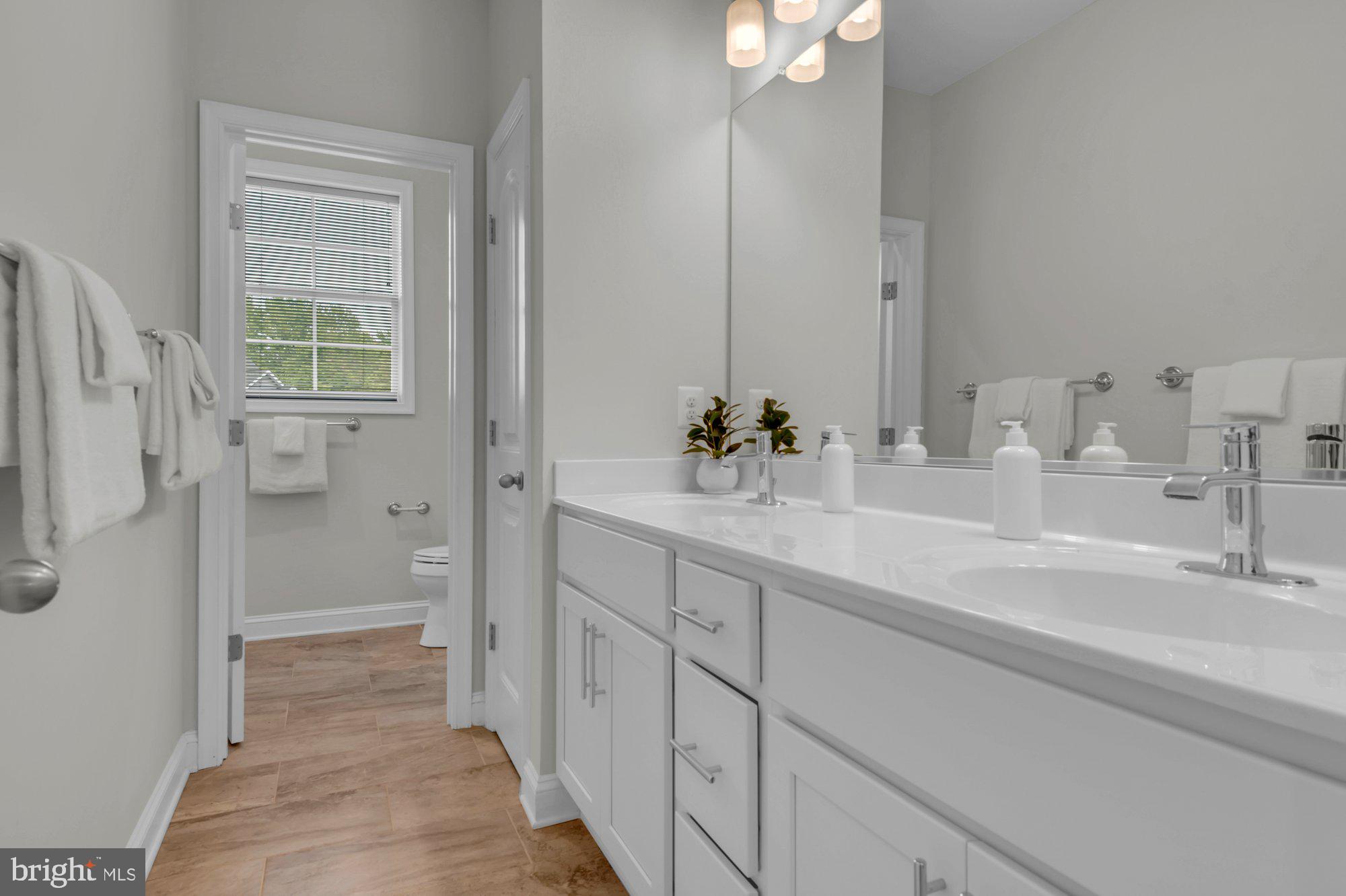 505 Brewerton Lane Edgewater, MD 21037 - Photo 42 of 78 a bathroom with a sink and a mirror