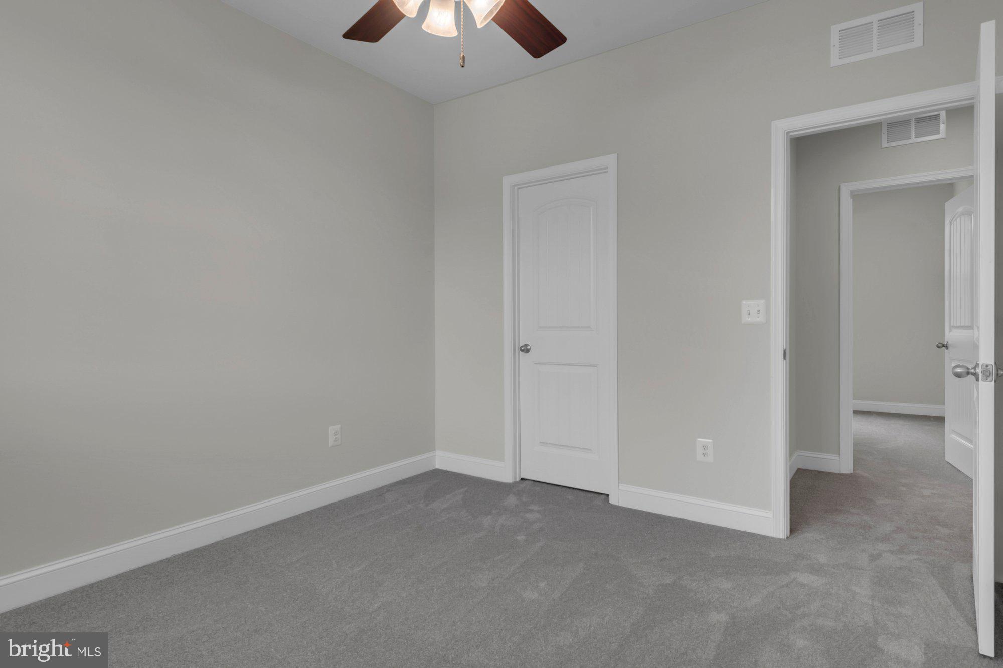 505 Brewerton Lane Edgewater, MD 21037 - Photo 45 of 78 an empty room with a chandelier fan