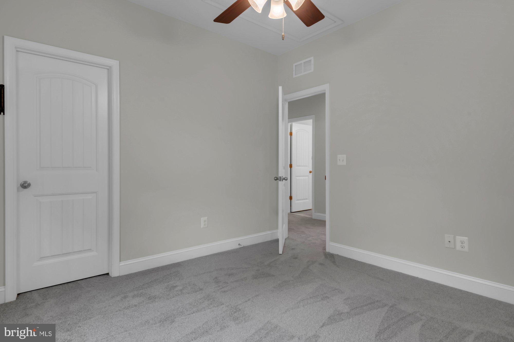 505 Brewerton Lane Edgewater, MD 21037 - Photo 47 of 78 an empty room with a empty space and a ceiling fan