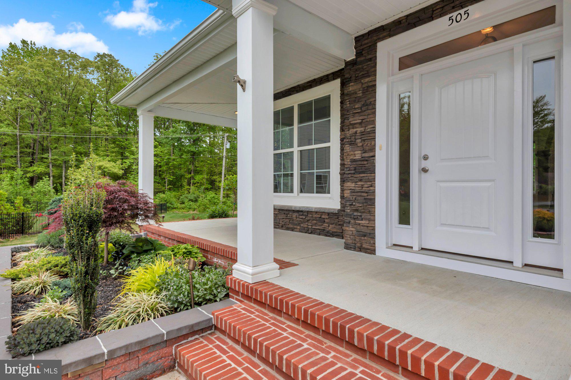 505 Brewerton Lane Edgewater, MD 21037 - Photo 5 of 78 a front view of a house with a yard