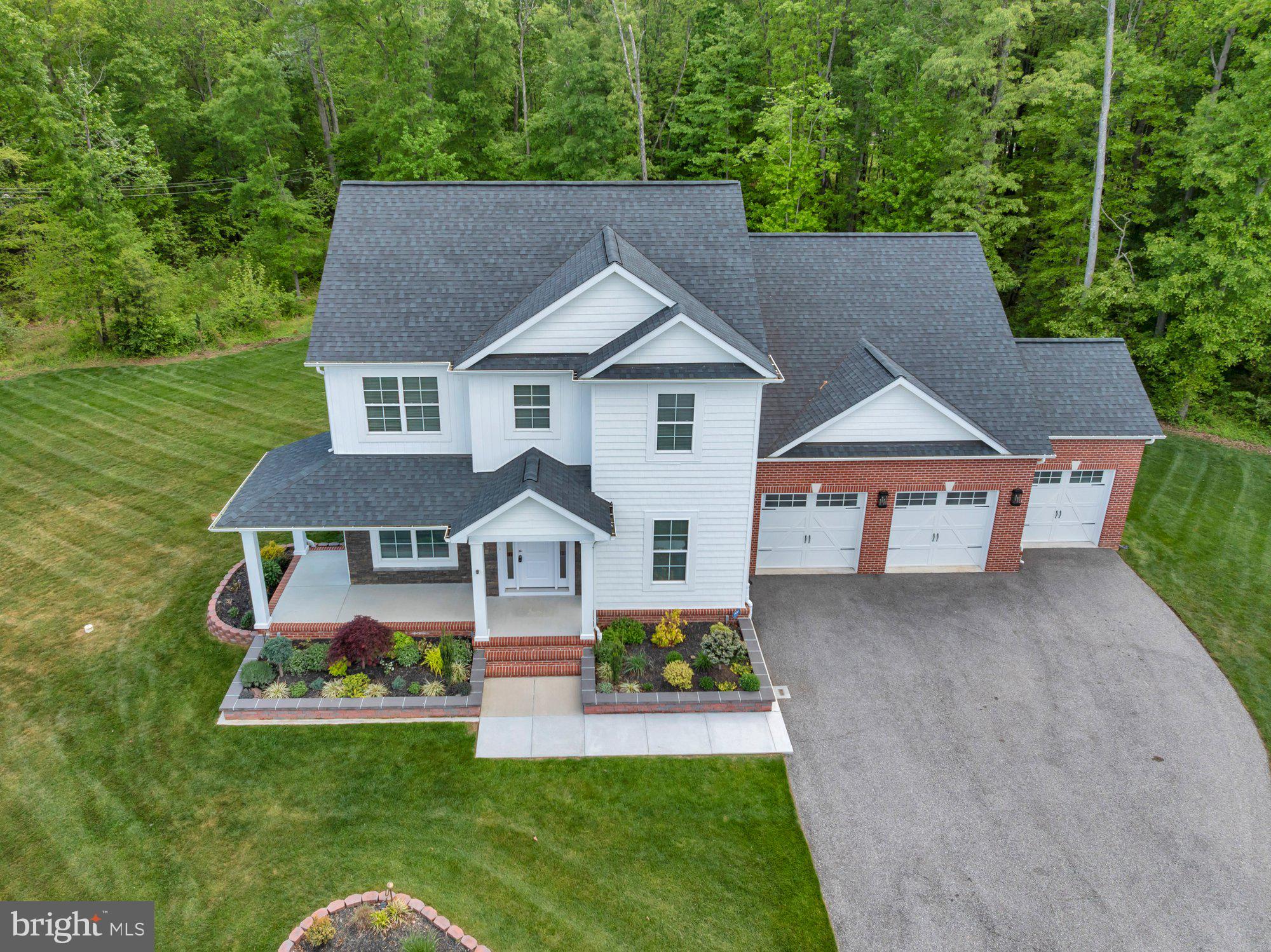 505 Brewerton Lane Edgewater, MD 21037 - Photo 55 of 78 a front view of house with yard and green space