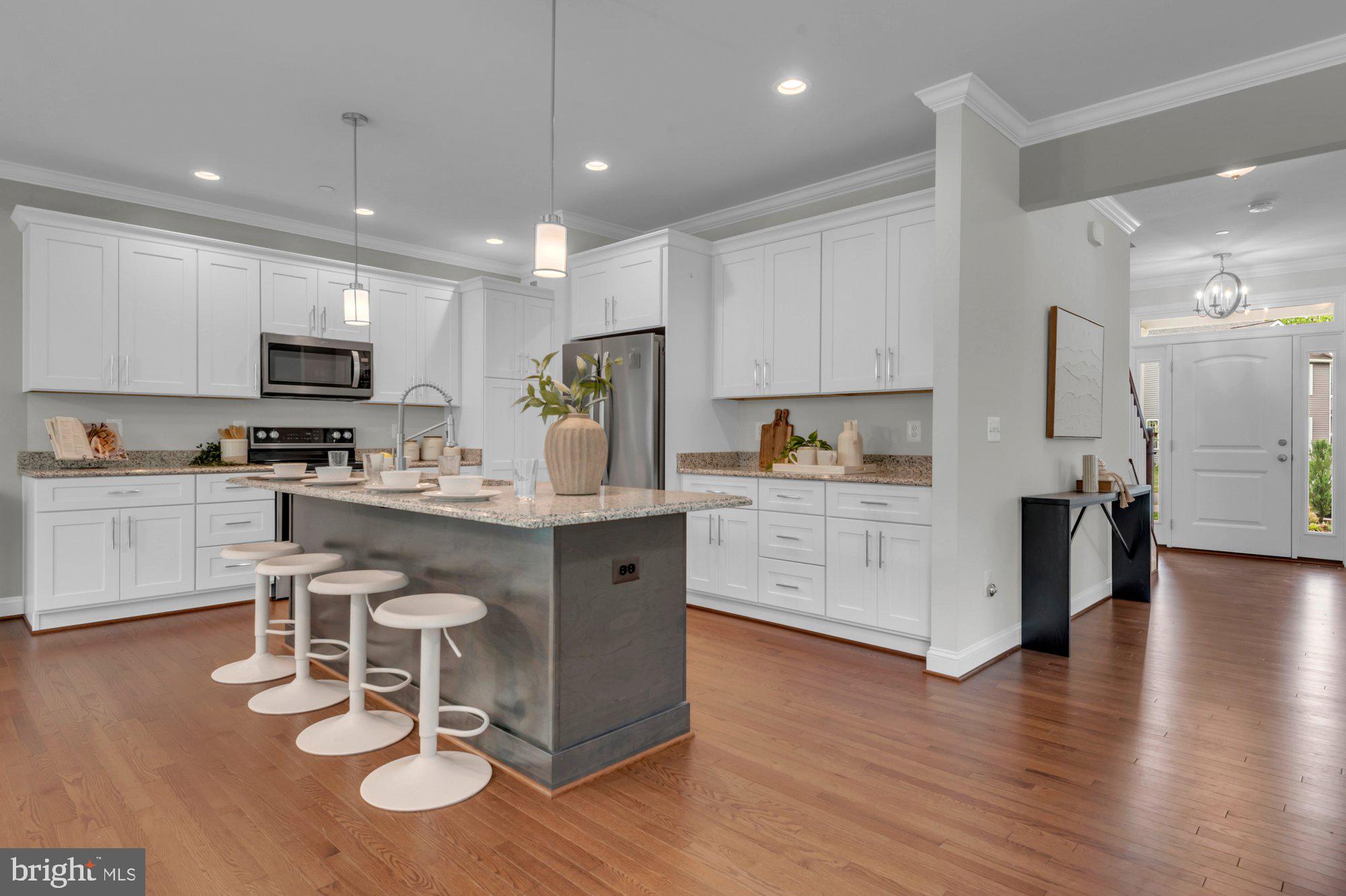 505 Brewerton Lane Edgewater, MD 21037 - Photo 6 of 78 a kitchen with granite countertop white cabinets stainless steel appliances and sink