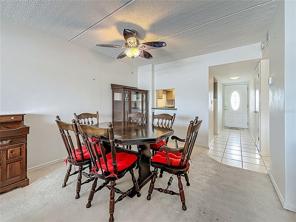 1 Boca Ciega Point Boulevard, Unit 215 St. Petersburg, FL 33708 - Photo 12 of 39 a view of a dining room with furniture