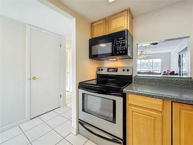 a kitchen with a stove and a microwave