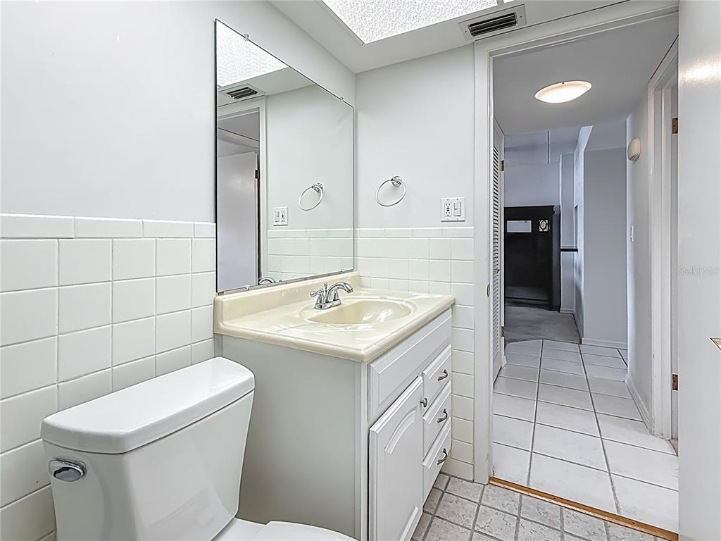 1 Boca Ciega Point Boulevard, Unit 215 St. Petersburg, FL 33708 - Photo 24 of 39 a bathroom with a sink a toilet and shower