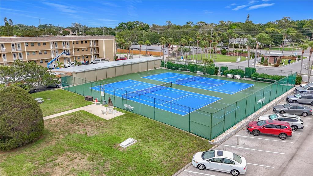 1 Boca Ciega Point Boulevard, Unit 215 St. Petersburg, FL 33708 - Photo 31 of 39 a view of a balcony with two chairs and a table