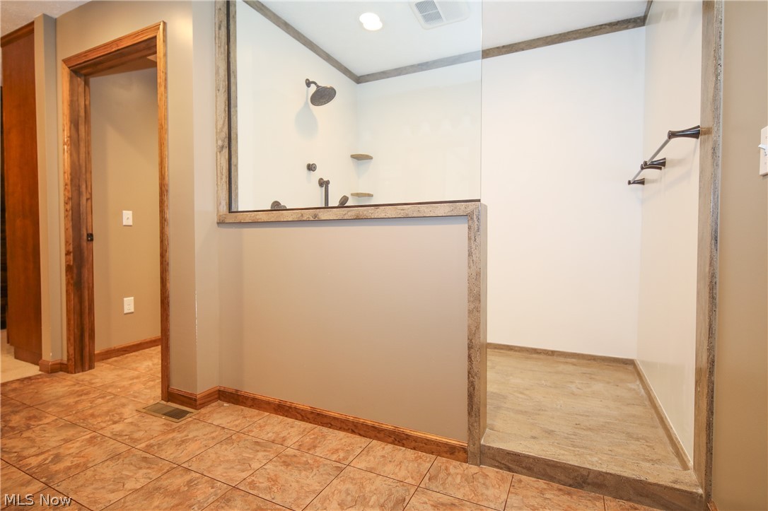 38610 Spiedel Town Road Bethesda, OH 43719 - Photo 21 of 33 Bathroom featuring ornamental molding and tile patterned floors