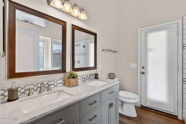 a bathroom with a bathtub and shower