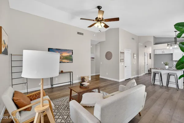 a living room with furniture and a table