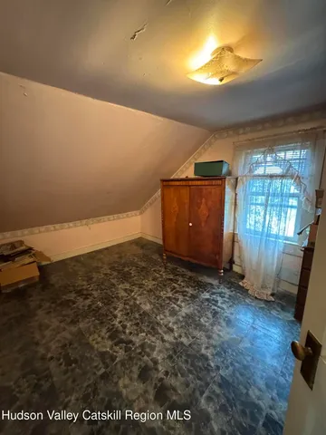 a view of a room with a window