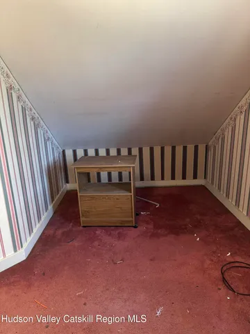 a view of balcony with furniture