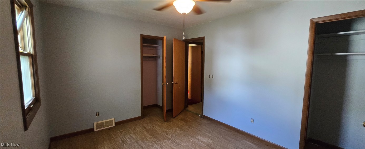 321 Magnolia Road Huron, OH 44839 - Photo 14 of 23 Unfurnished bedroom with ceiling fan and hardwood / wood-style flooring