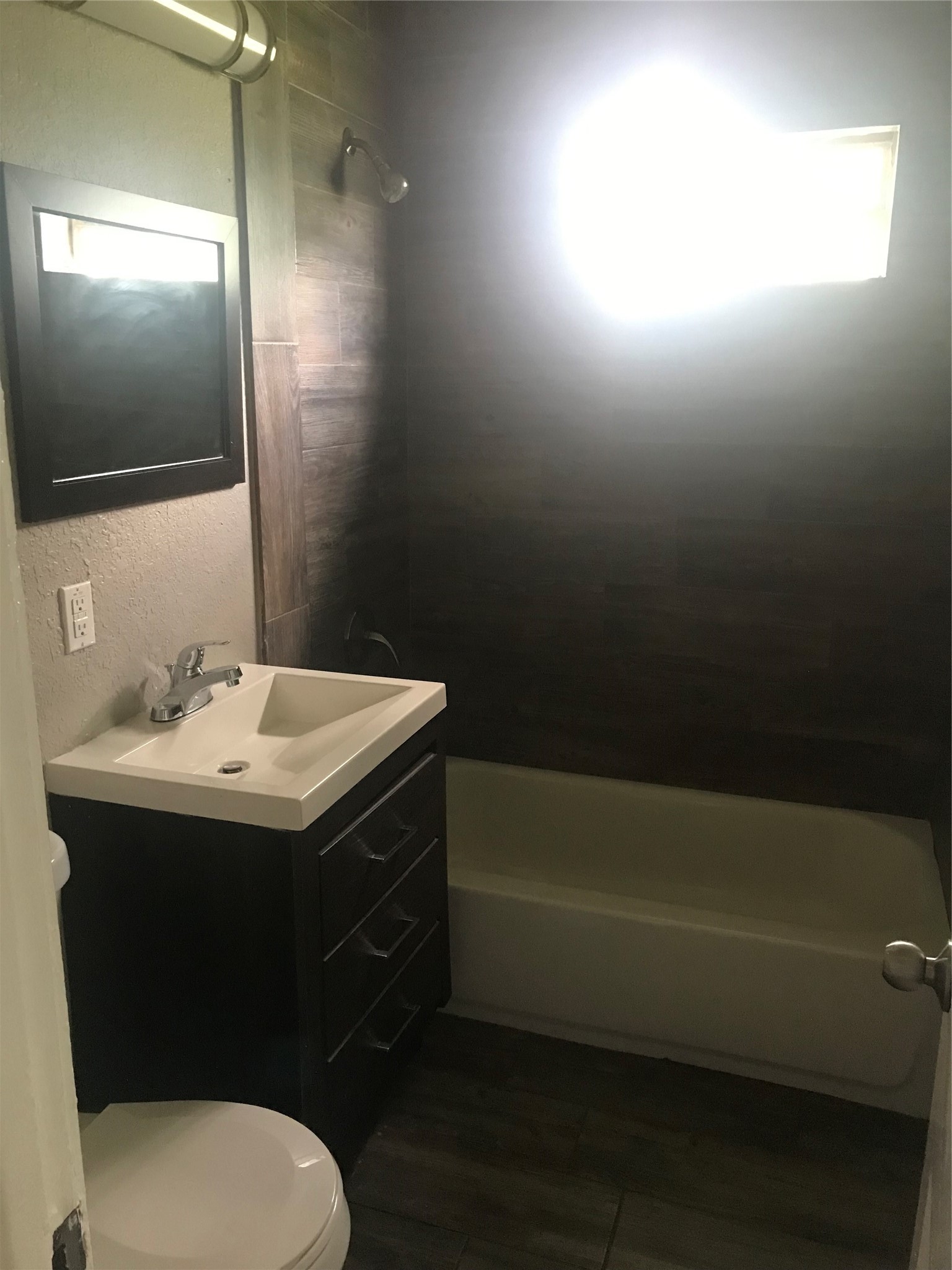 1713 West 5th Street Freeport, TX 77541 - Photo 7 of 11 a bathroom with a sink toilet and shower