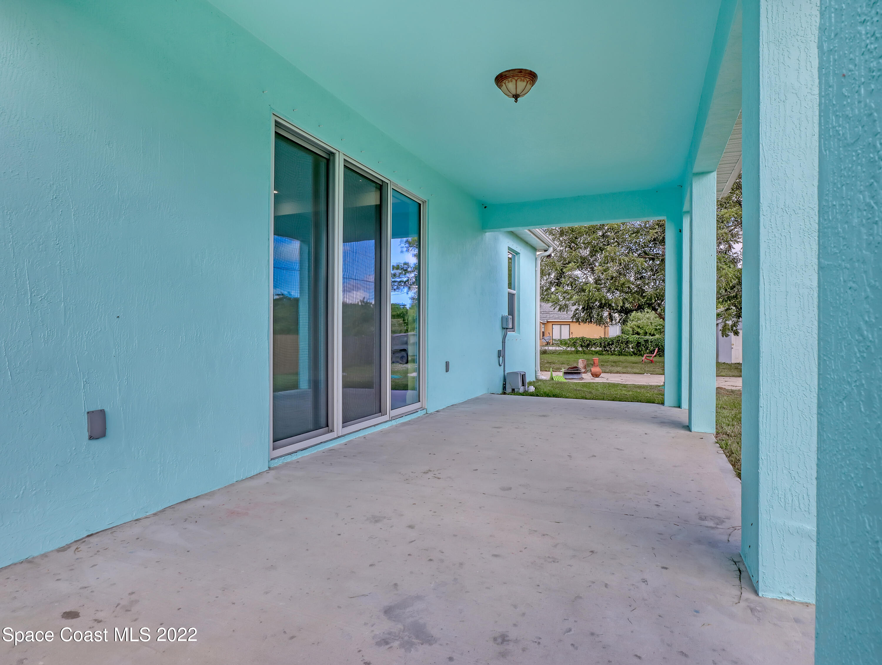 585 Degroodt Road Southwest Palm Bay, FL 32908 - Photo 12 of 40 Large Trussed Lanai