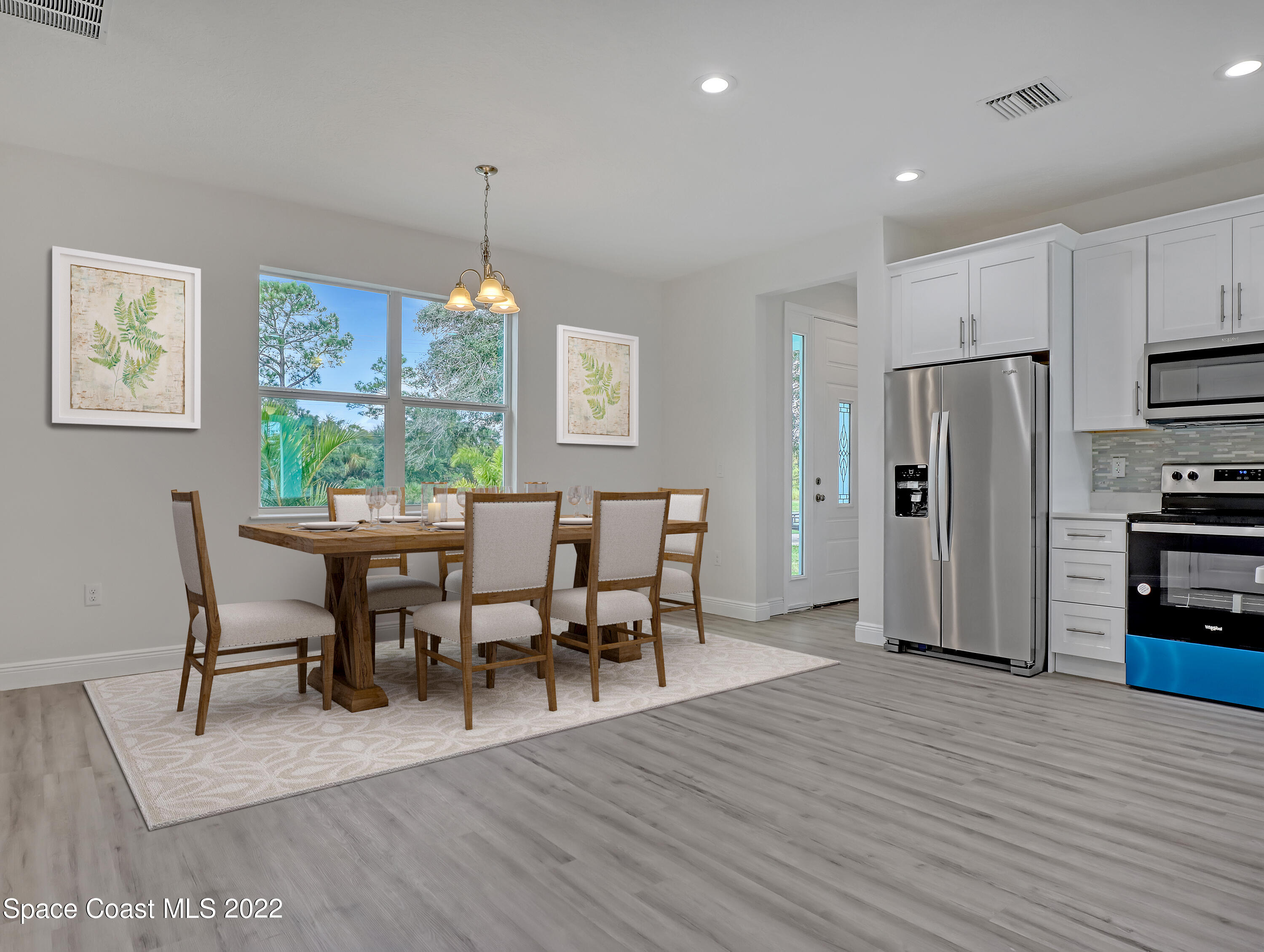 585 Degroodt Road Southwest Palm Bay, FL 32908 - Photo 2 of 40 Dining Room / Kitchen