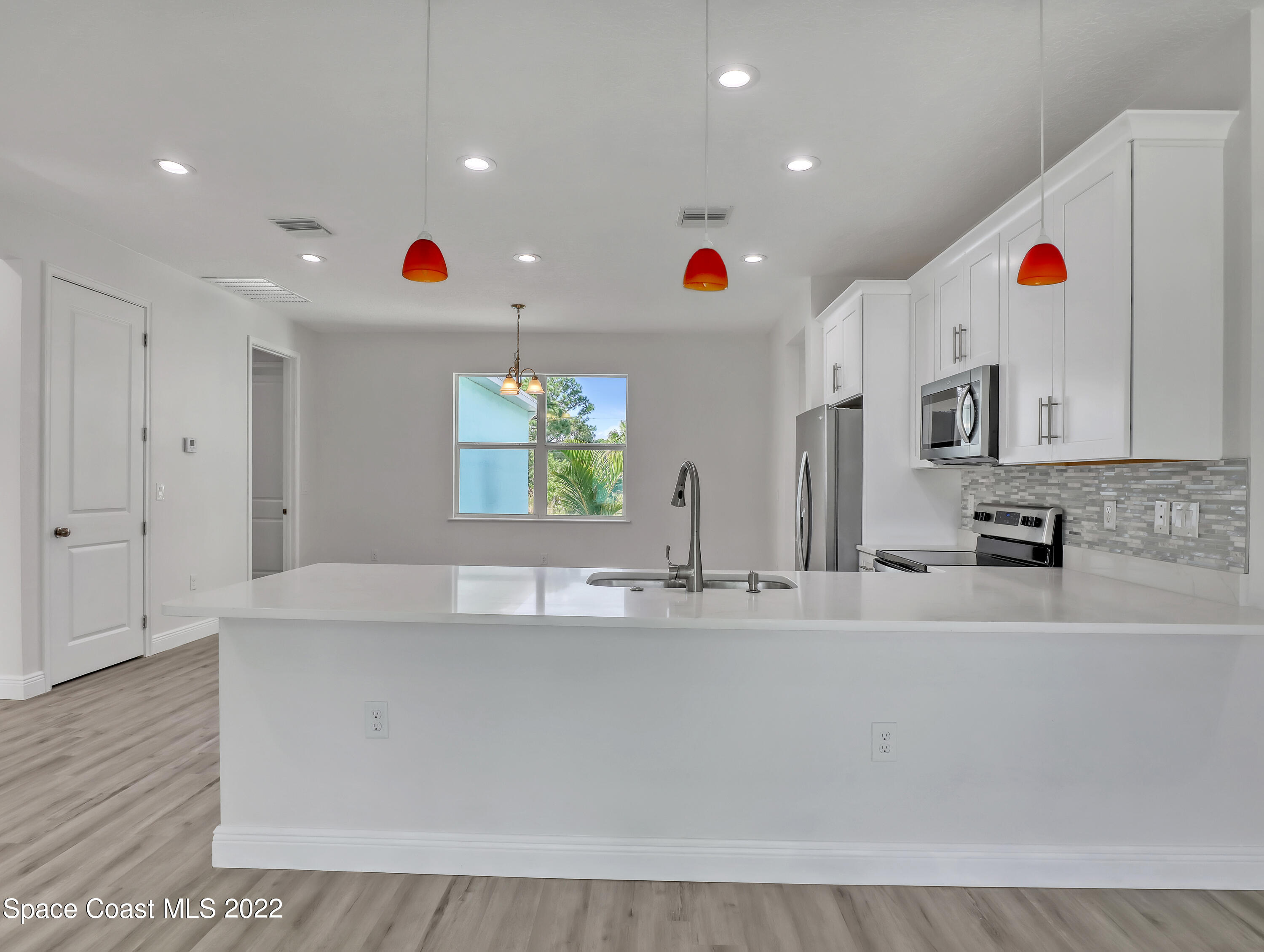 585 Degroodt Road Southwest Palm Bay, FL 32908 - Photo 28 of 40 White Shaker Cabinets