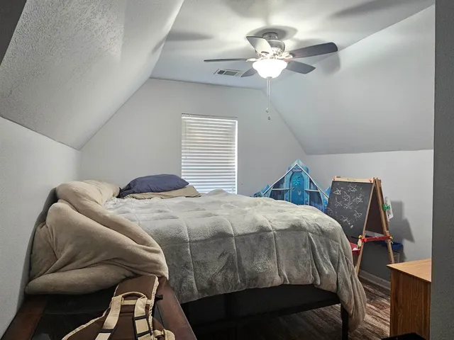 a backyard of a house with sofas fire pit and outdoor seating