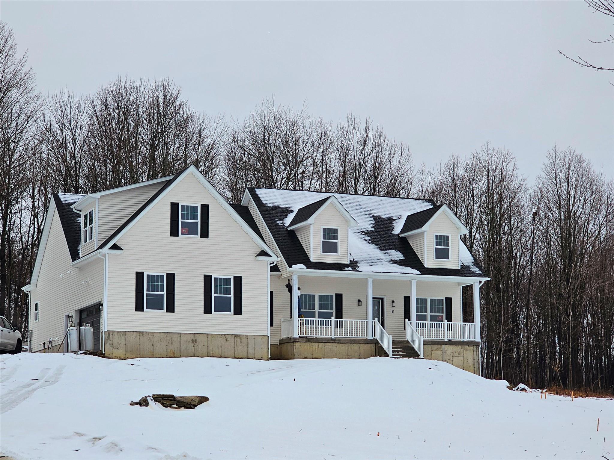 5 Domingues Road Newburgh, NY 12550 - Photo 1 of 1 New england style home featuring a garage, central AC, and a porch