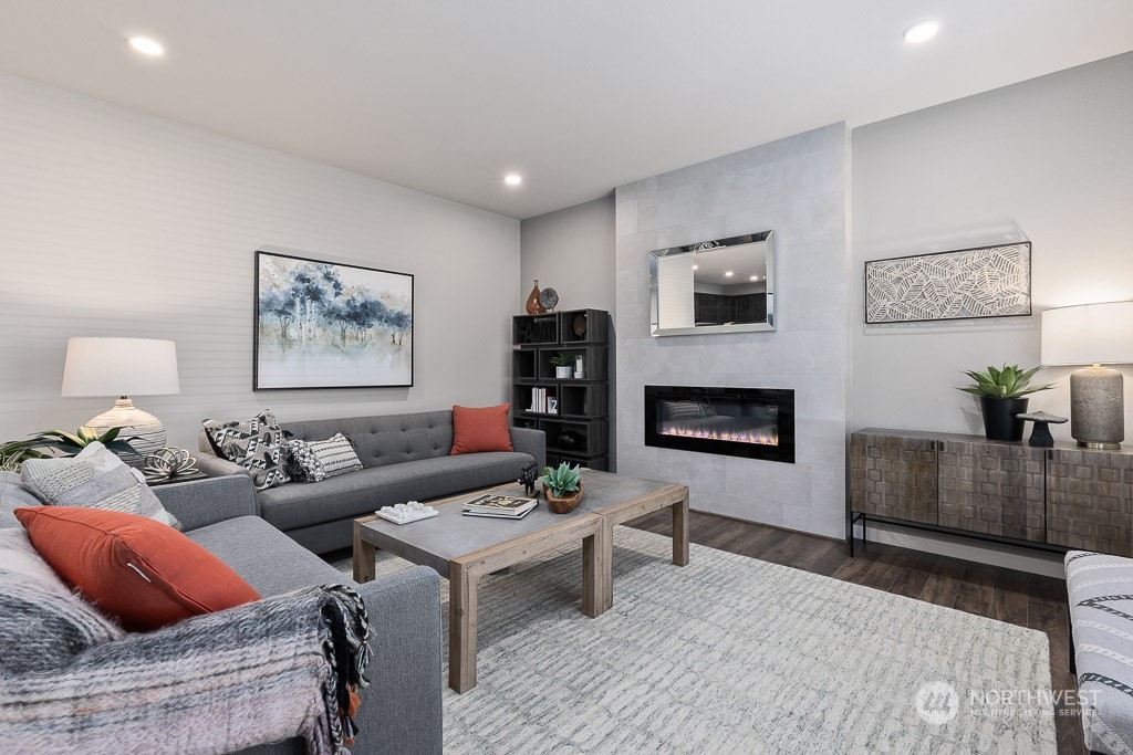 621 215th Street Southeast, Unit RM21 Bothell, WA 98021 - Photo 11 of 29 a living room with furniture and a fireplace