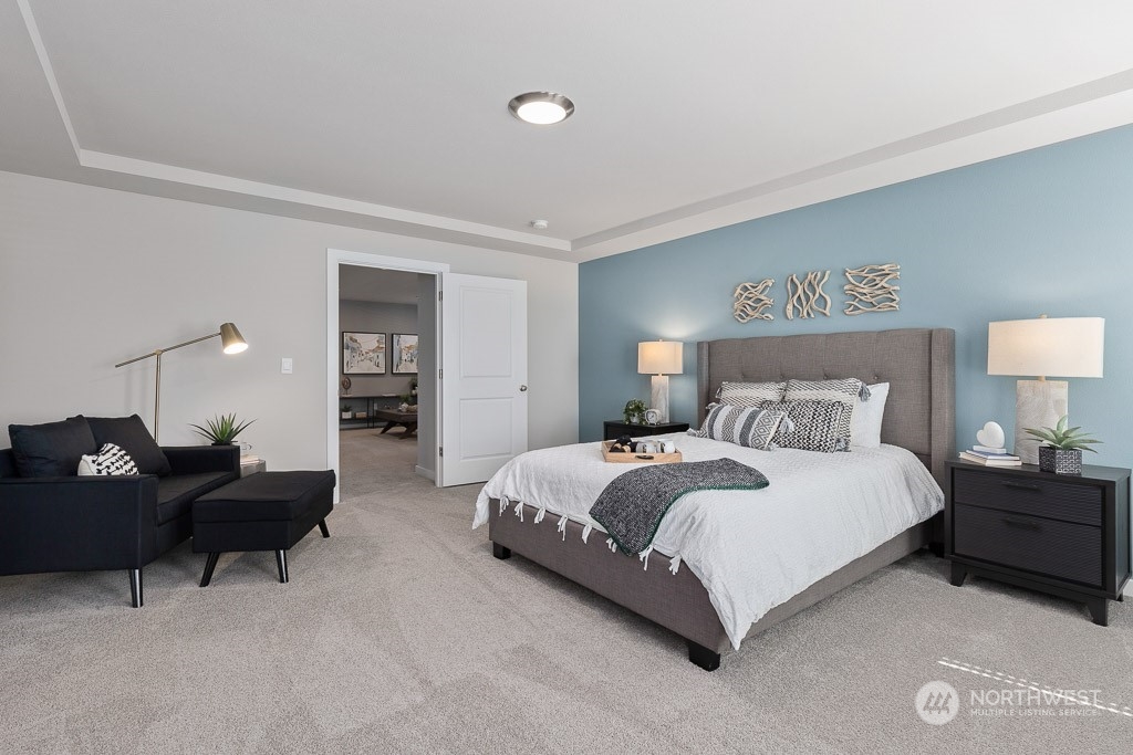621 215th Street Southeast, Unit RM21 Bothell, WA 98021 - Photo 19 of 29 a bedroom with a bed and lamp