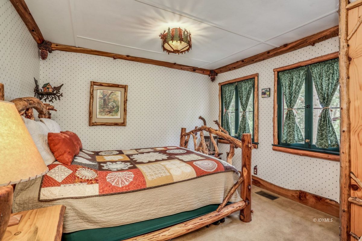 55255 Daryll Road Idyllwild, CA 92549 - Photo 17 of 41 a bedroom with a bed and a window