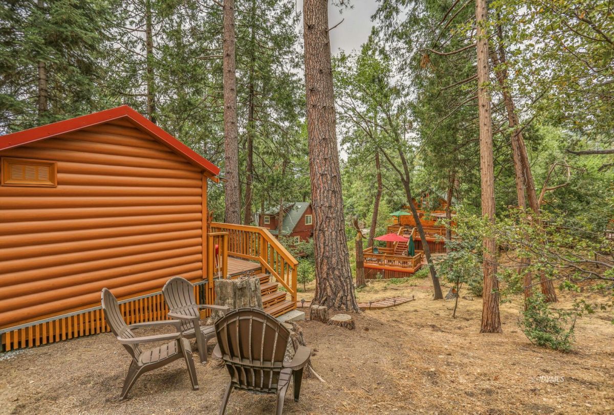 55255 Daryll Road Idyllwild, CA 92549 - Photo 35 of 41 a backyard of a house with table and chairs