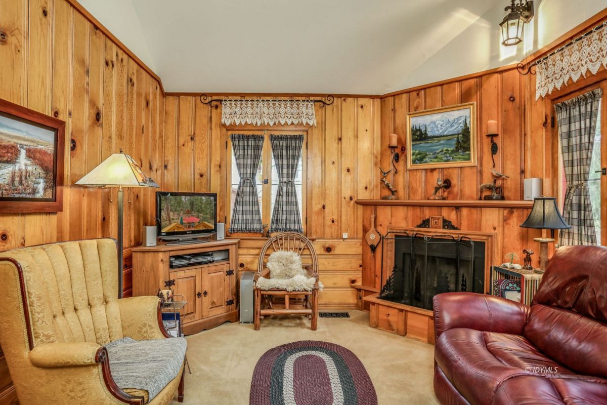 55255 Daryll Road Idyllwild, CA 92549 - Photo 10 of 41 a living room with furniture a fireplace and flat screen tv
