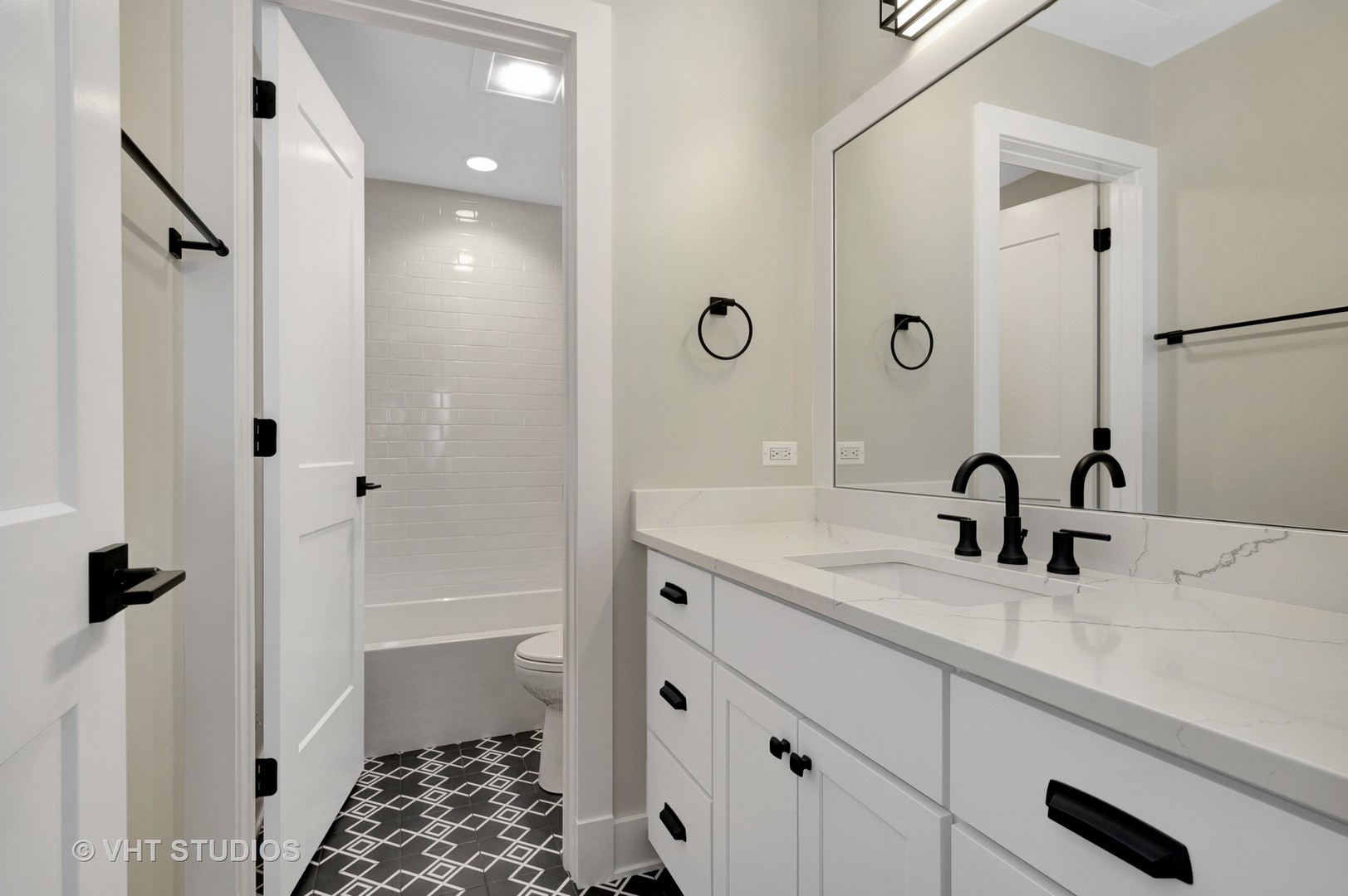 3712 North Marshfield Avenue Chicago, IL 60613 - Photo 15 of 21 a bathroom with a granite countertop sink a toilet and shower