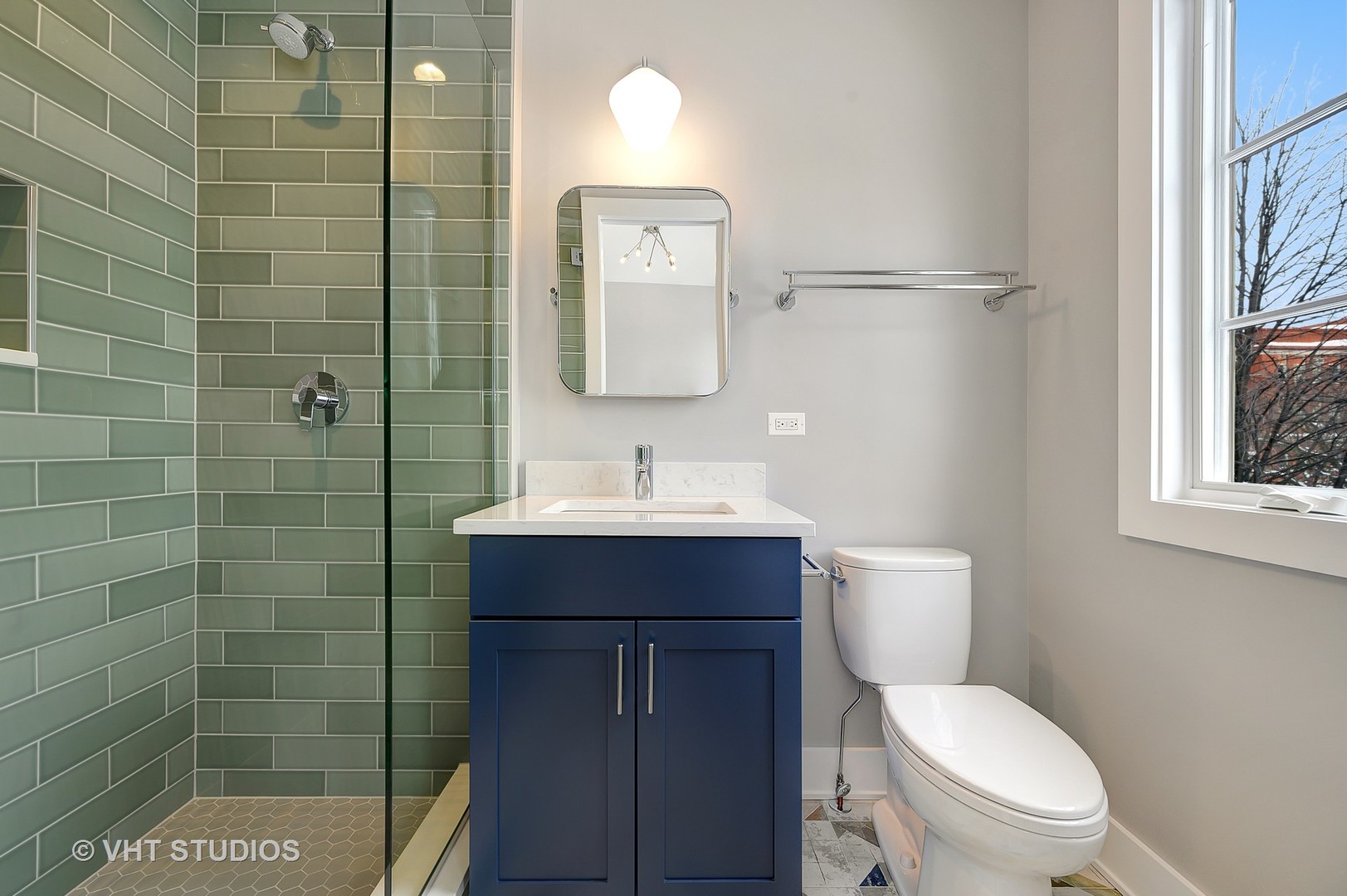 3712 North Marshfield Avenue Chicago, IL 60613 - Photo 18 of 21 a bathroom with a toilet a sink and mirror