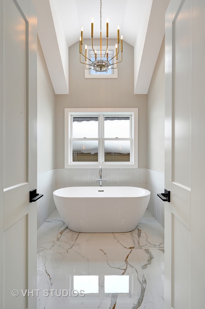 3712 North Marshfield Avenue Chicago, IL 60613 - Photo 10 of 21 a bathroom with a sink and a mirror