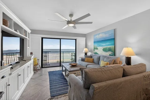 a dining room with furniture and a window