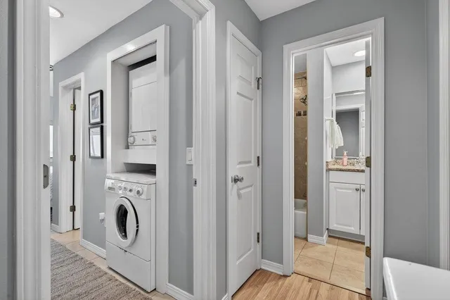 a view of a hallway with washer and dryer