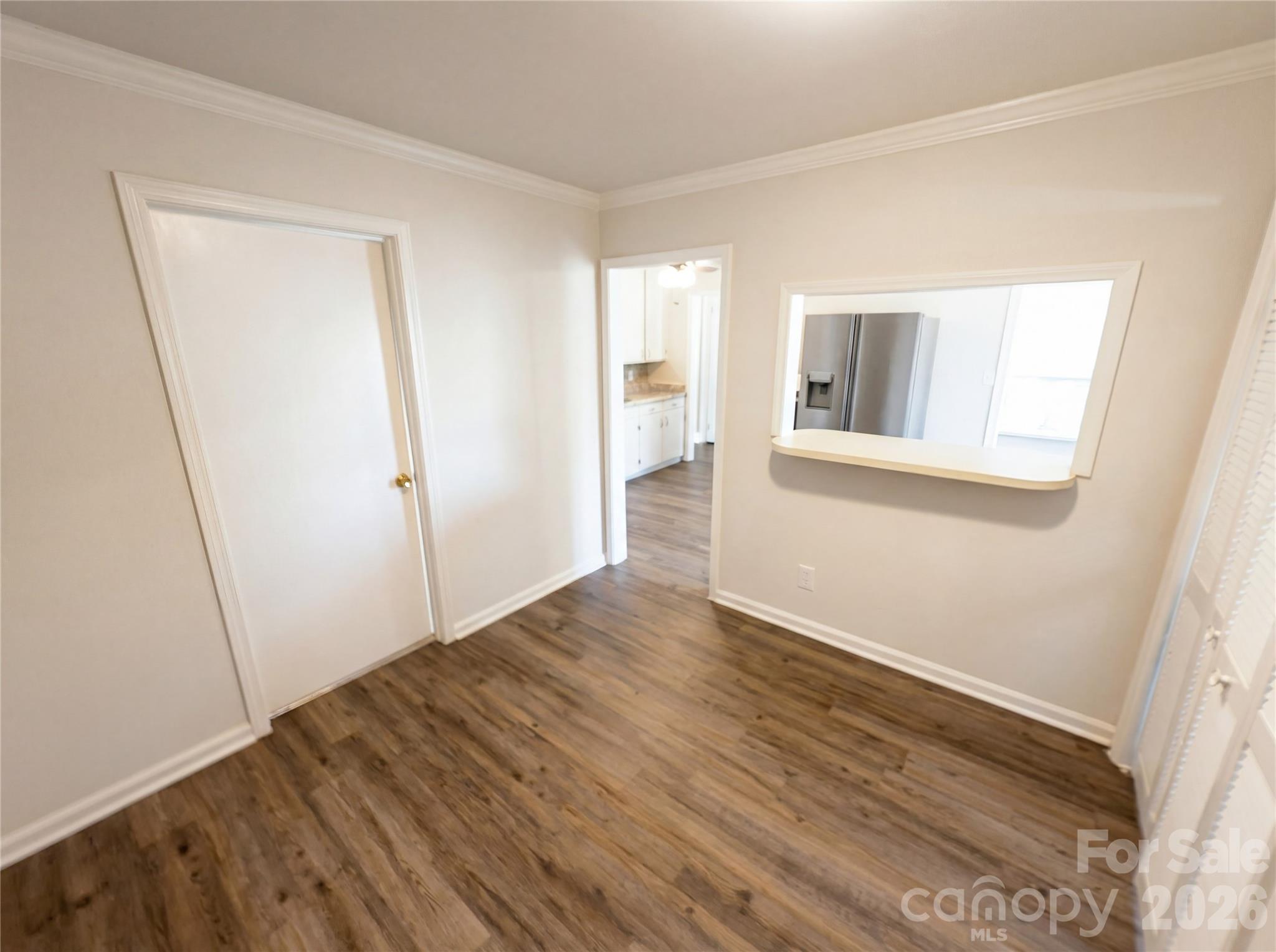 633 Briarcliff Road Rock Hill, SC 29730 - Photo 12 of 14 a view of an empty room with wooden floor and a window