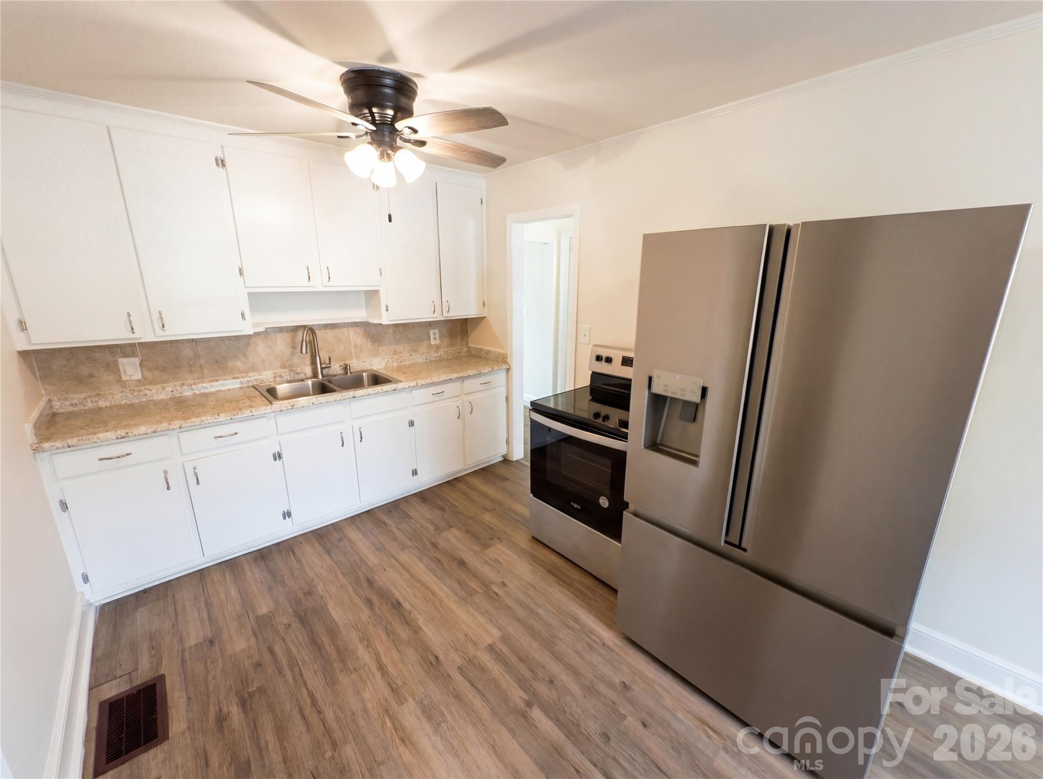 633 Briarcliff Road Rock Hill, SC 29730 - Photo 2 of 14 a kitchen with a sink stainless steel appliances a counter top space and cabinets