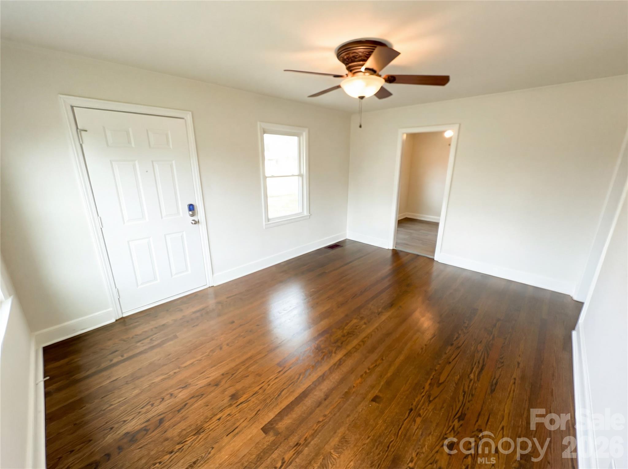633 Briarcliff Road Rock Hill, SC 29730 - Photo 3 of 14 wooden floor in an empty room with a window