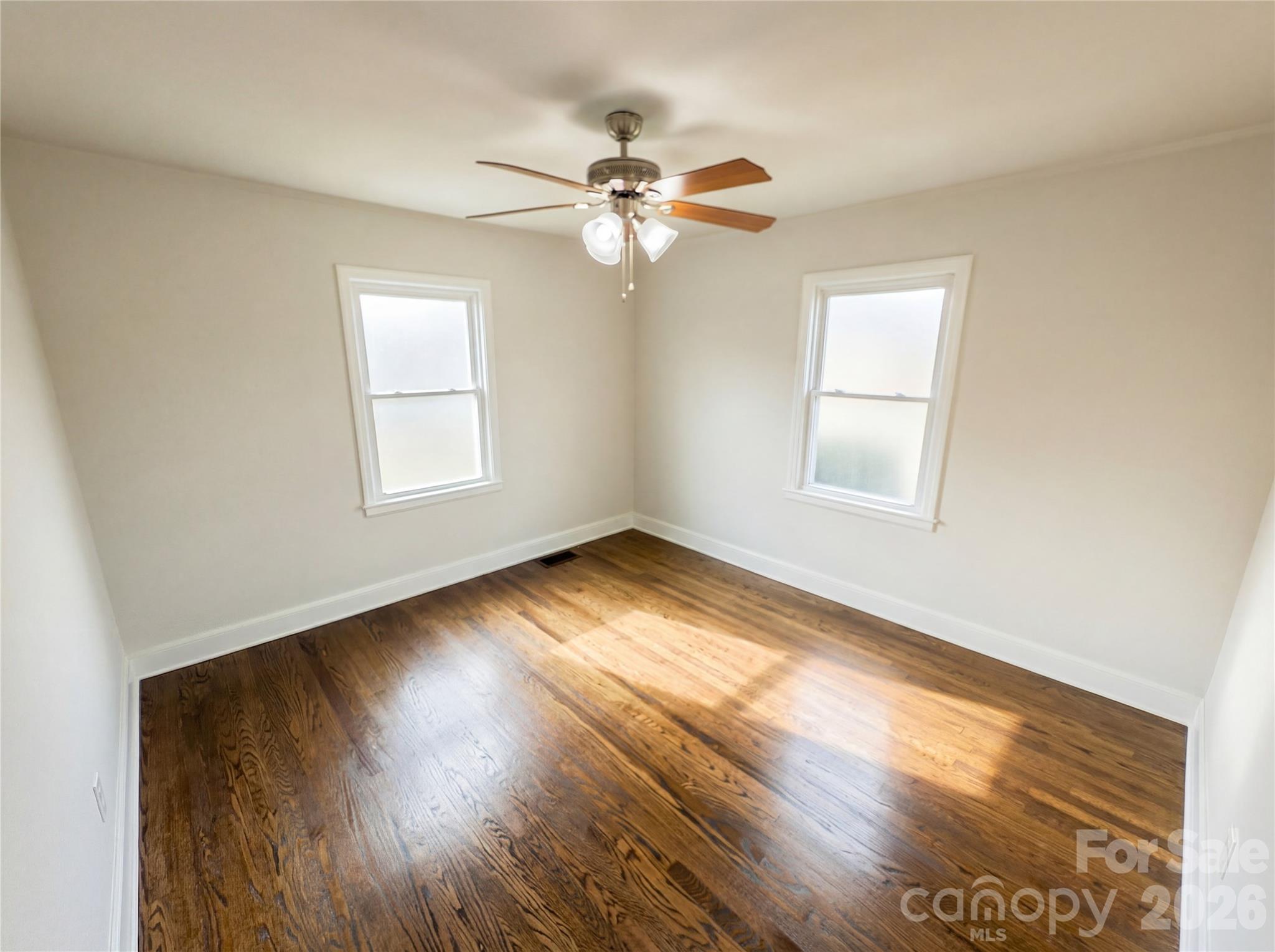 633 Briarcliff Road Rock Hill, SC 29730 - Photo 9 of 14 a view of empty room with wooden floor and fan