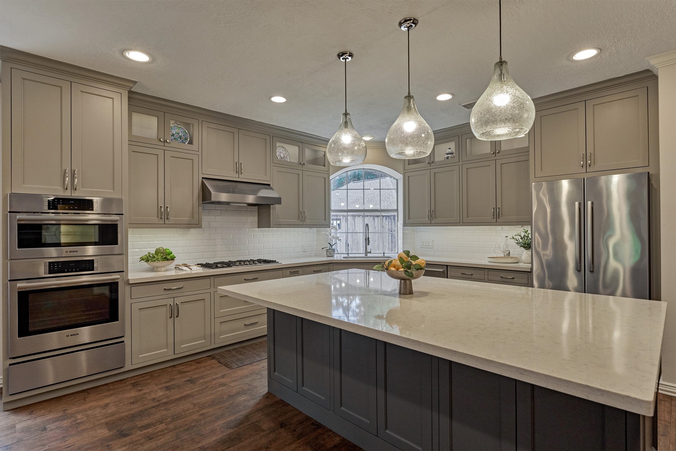 16707 Avenfield Road Tomball, TX 77377 - Photo 11 of 50 a large kitchen with a sink and stainless steel appliances