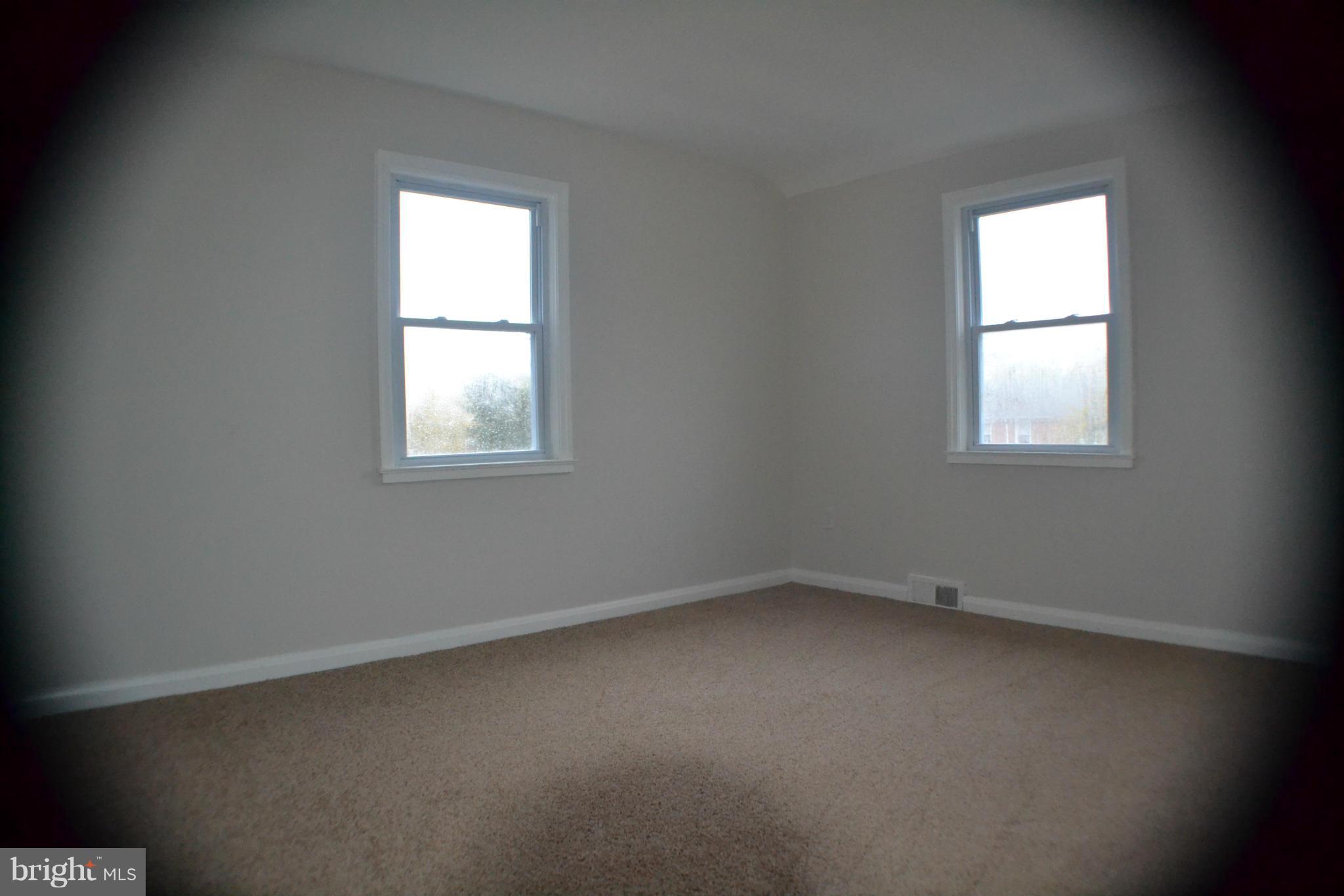 1424 Cedarcroft Road Baltimore, MD 21239 - Photo 12 of 16 an empty room with a window