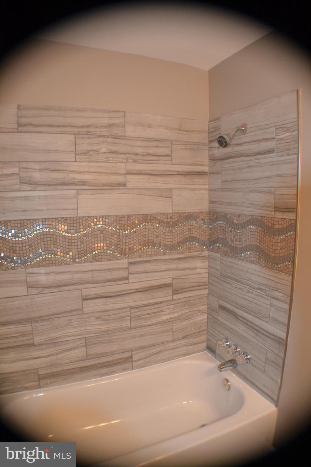 1424 Cedarcroft Road Baltimore, MD 21239 - Photo 14 of 16 a bathroom with a bathtub