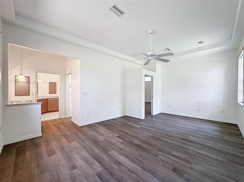 9237 Penelope Drive Weeki Wachee, FL 34613 - Photo 12 of 19 a view of a kitchen with wooden floor and a kitchen